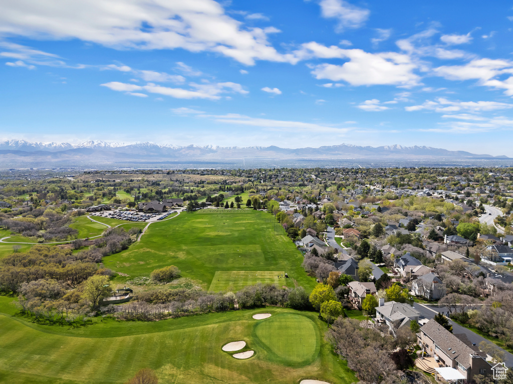 Aerial view with a residential view, a mountain view, and view of golf course