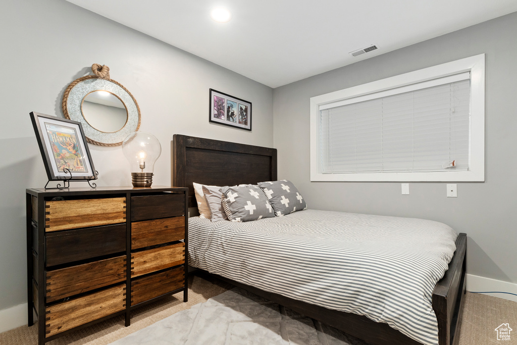 Bedroom featuring visible vents and baseboards