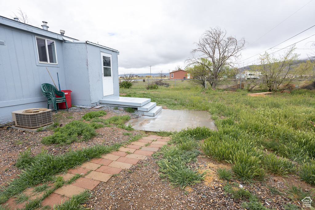 View of yard with central AC unit