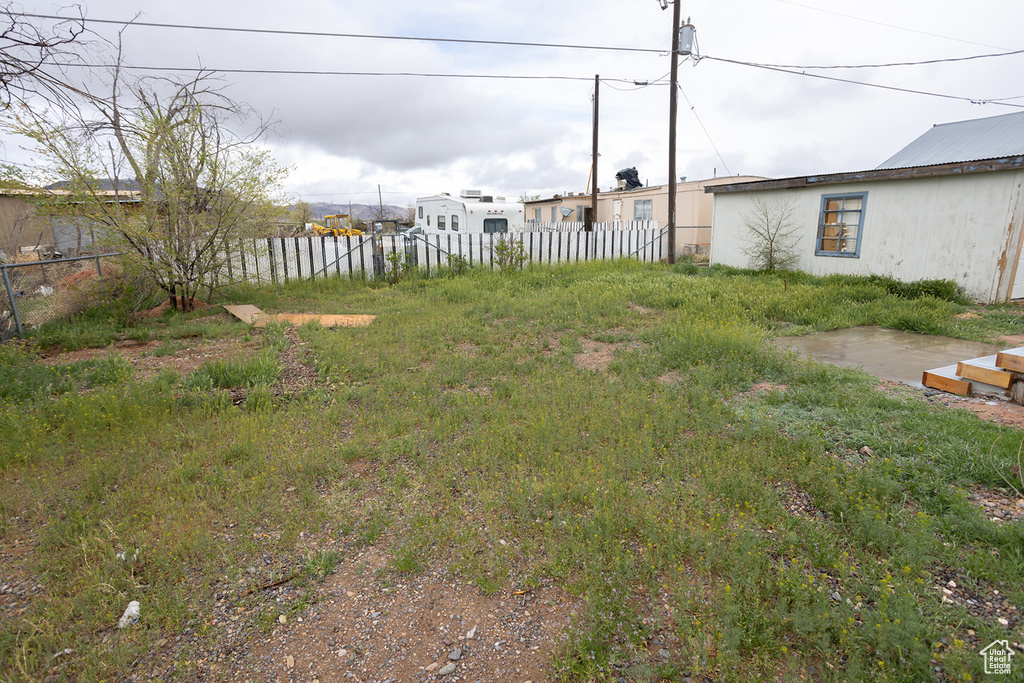View of yard featuring fence