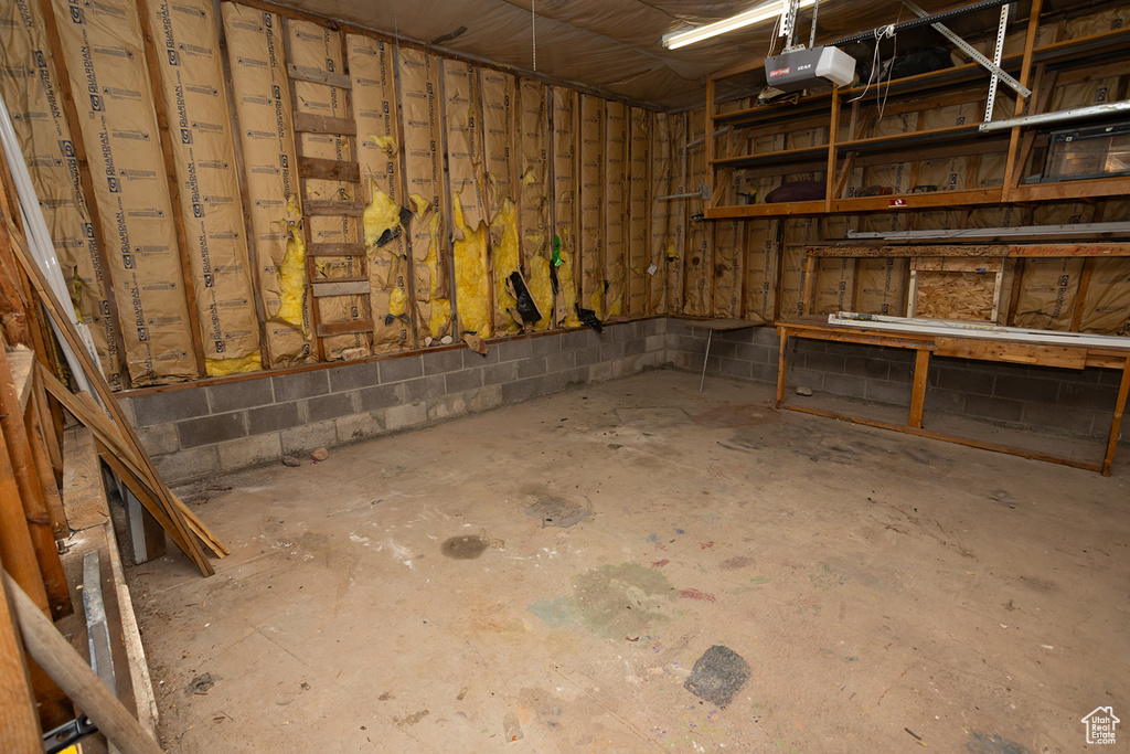 Basement featuring concrete block wall