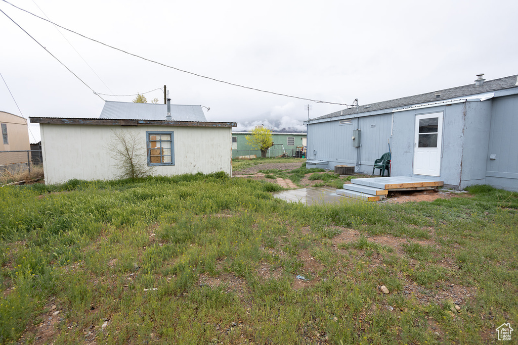 View of yard with central air condition unit