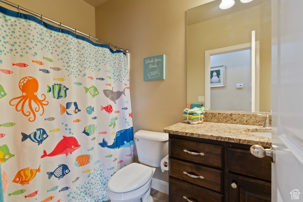 Bathroom with toilet and vanity