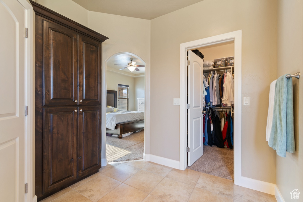 Interior space with tile flooring and ceiling fan