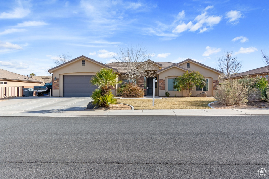 Ranch-style house featuring a garage