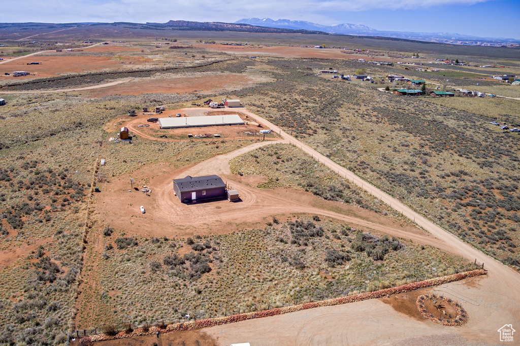 Drone / aerial view featuring a mountain view, a desert view, and a rural view