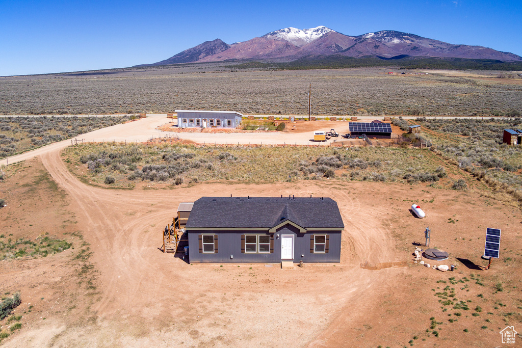 Birds eye view of property featuring a rural view, a desert view, and a mountain view