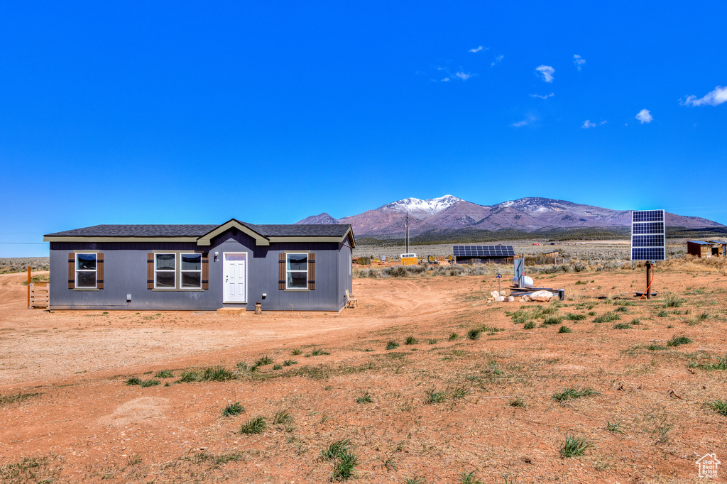 Exterior space with solar panels and a mountain view