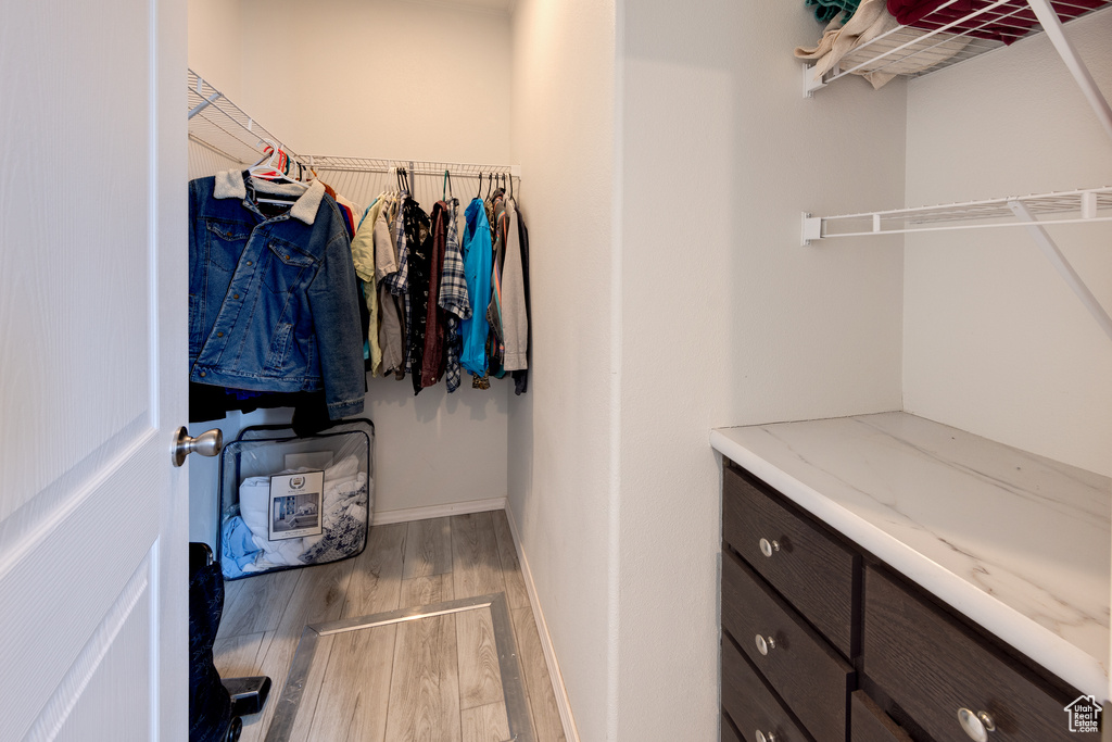 Spacious closet with wood finished floors