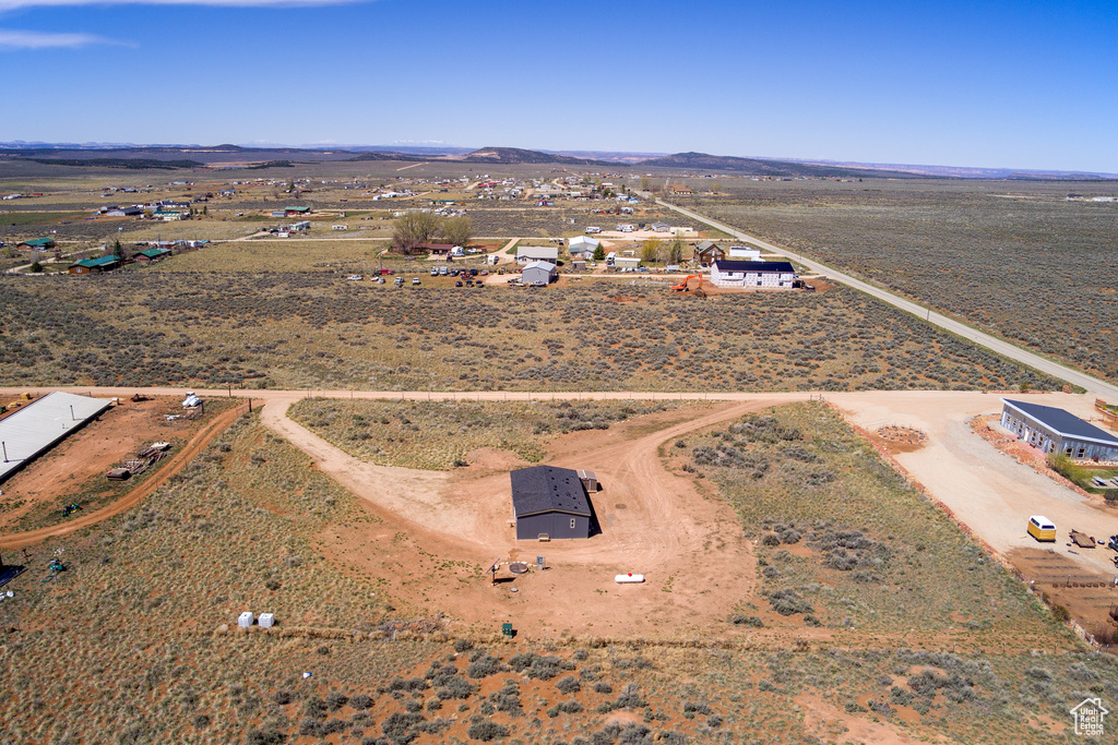 Birds eye view of property with a rural view, a desert view, and a mountain view