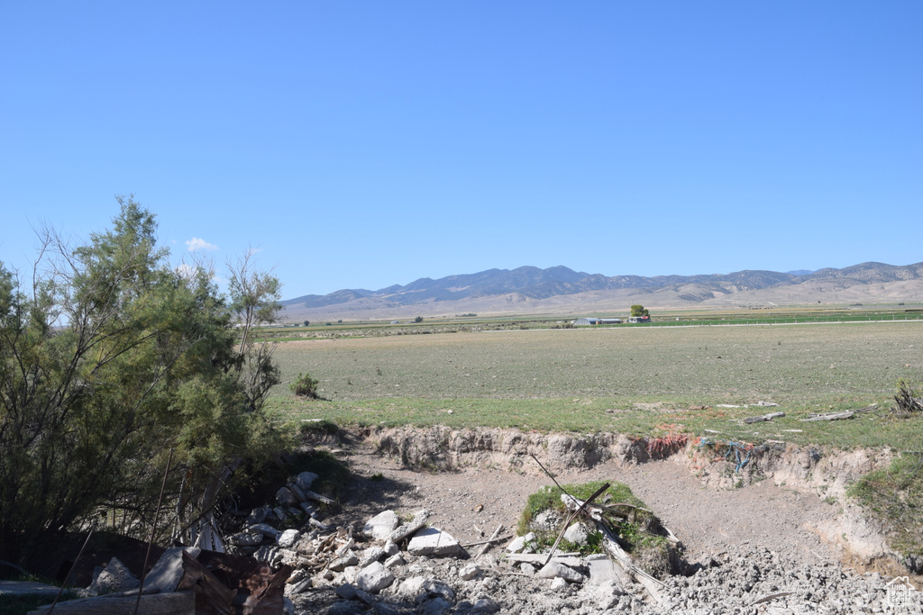 Property view of mountains with a rural view