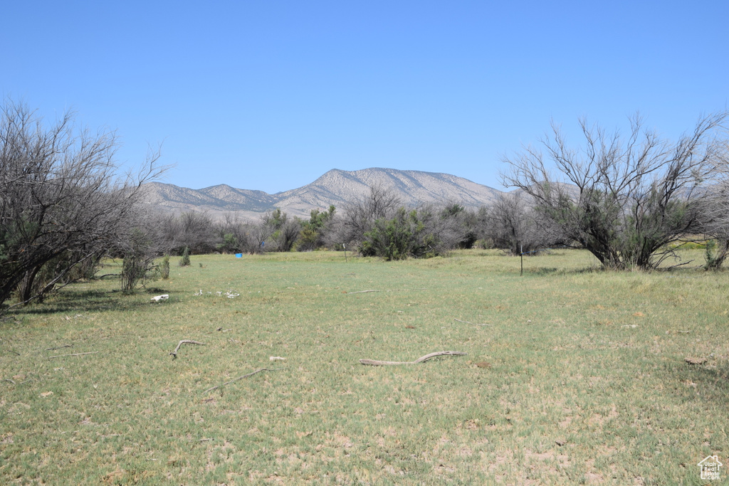 Property view of mountains with a rural view