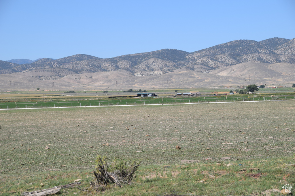 Property view of mountains with a rural view