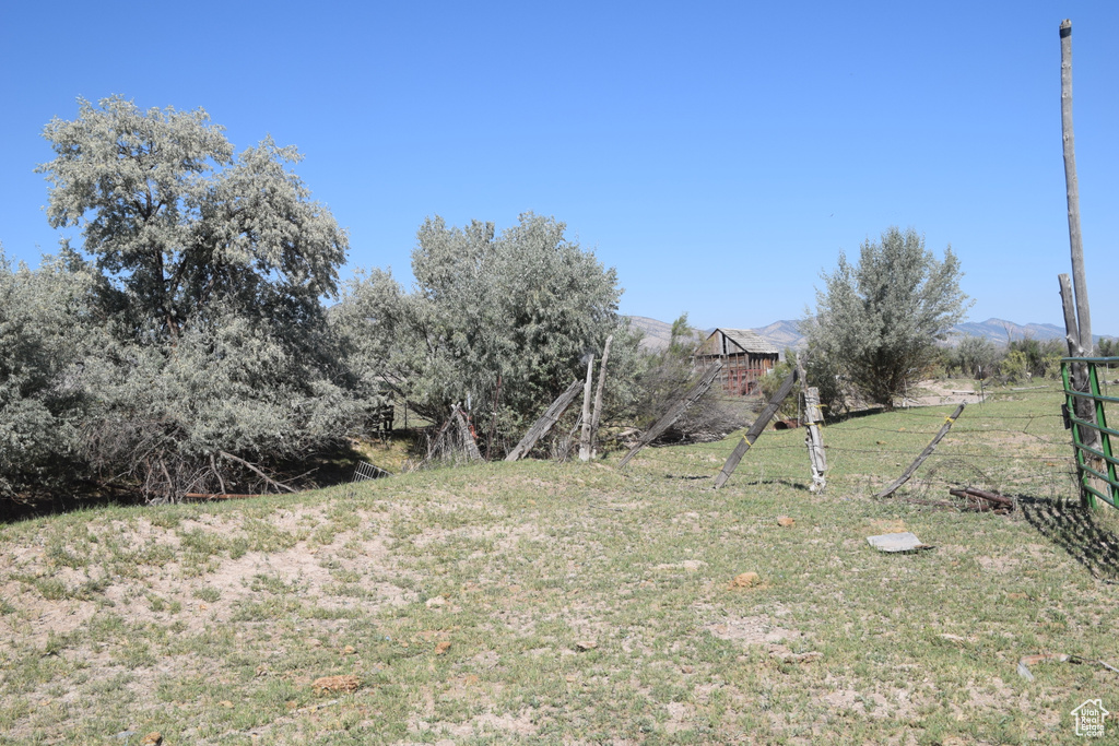 View of yard featuring fence