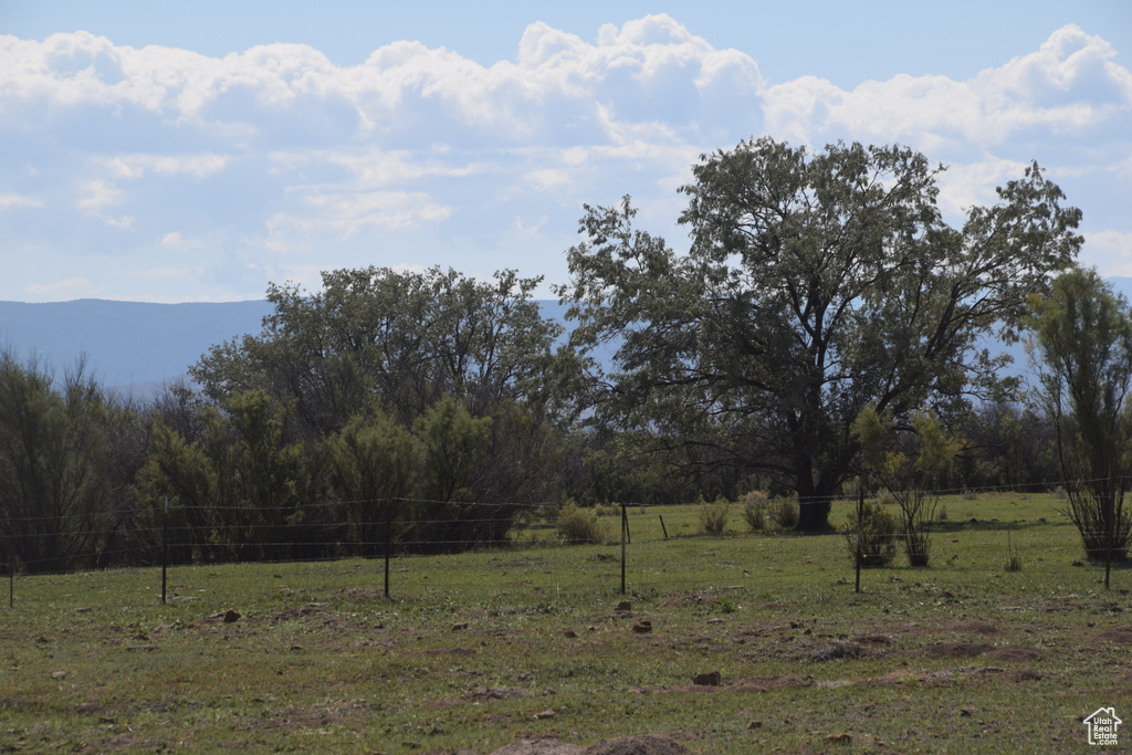 Exterior space with a rural view and fence