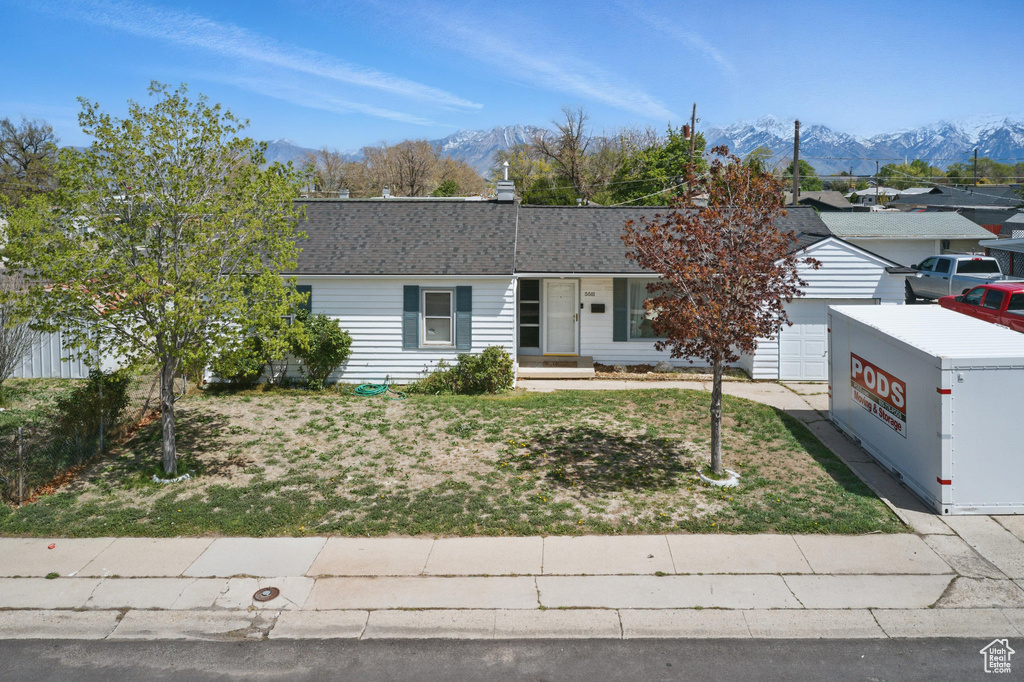 Single story home featuring a mountain view