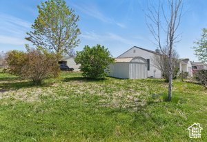 View of yard with an outbuilding