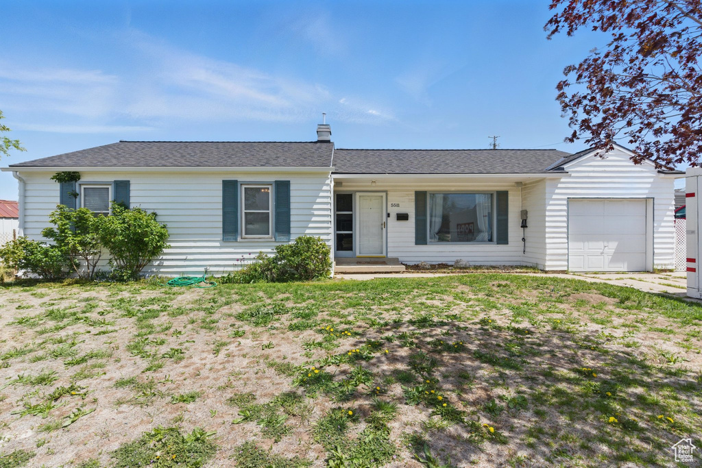 Single story home featuring a garage