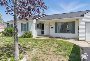 Single story home with a garage and driveway