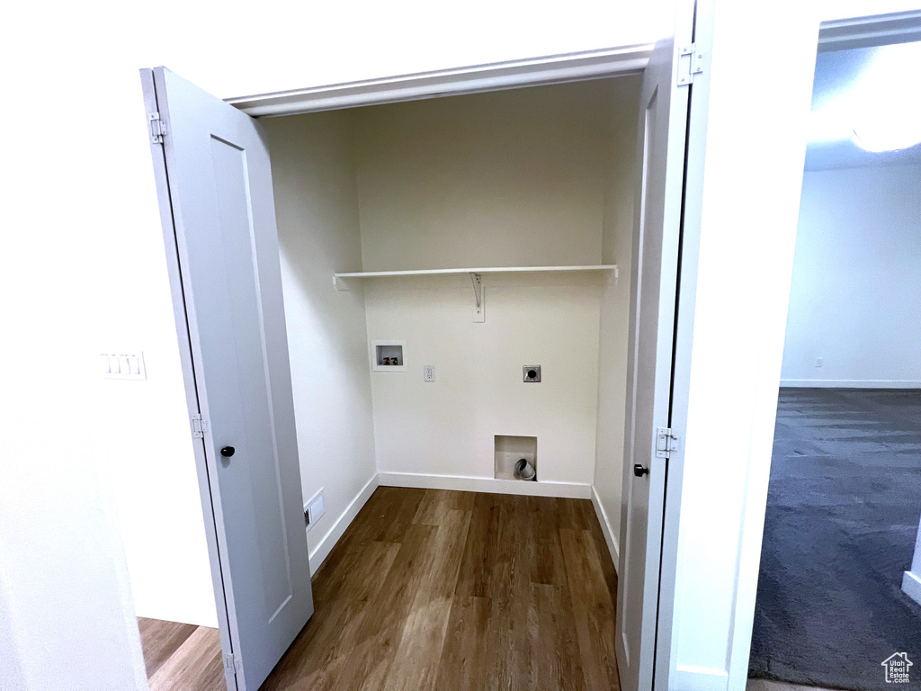Laundry room with laundry area, hookup for a washing machine, baseboards, and hookup for an electric dryer