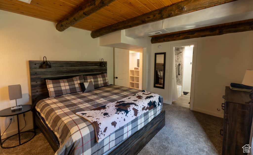 Bedroom featuring visible vents, beamed ceiling, baseboards, wooden ceiling, and carpet flooring