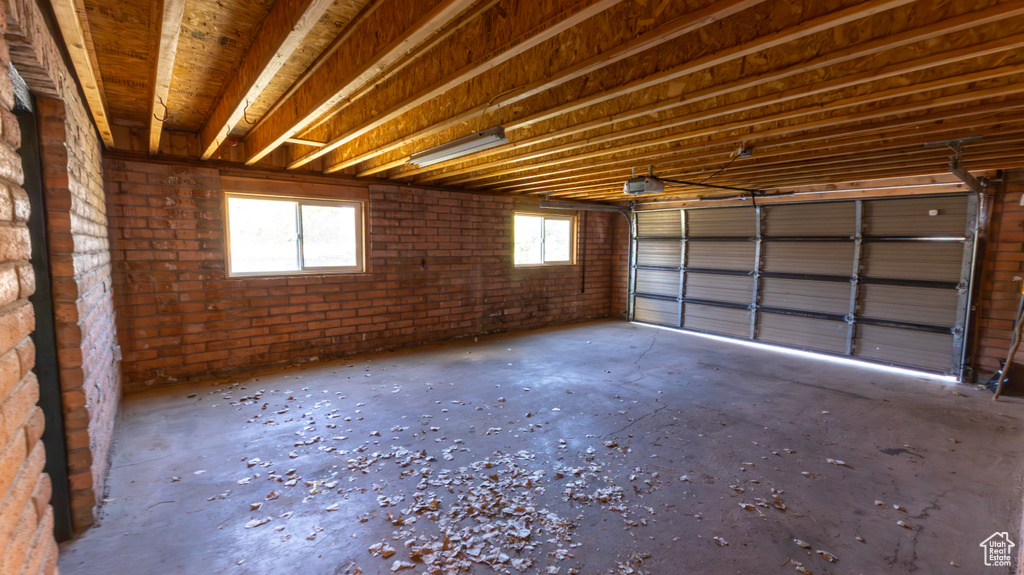 Garage featuring a garage door opener