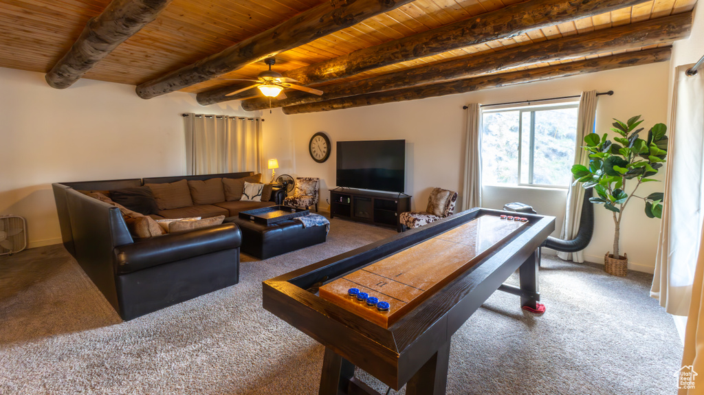 Game room with wood ceiling, carpet, a ceiling fan, and beam ceiling