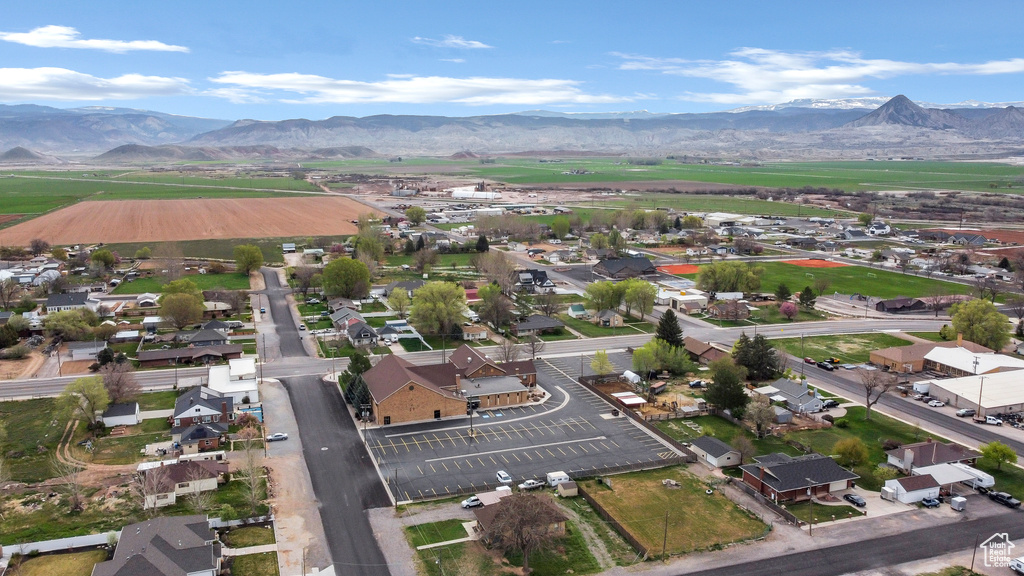 Birds eye view of property featuring a mountain view and a residential view