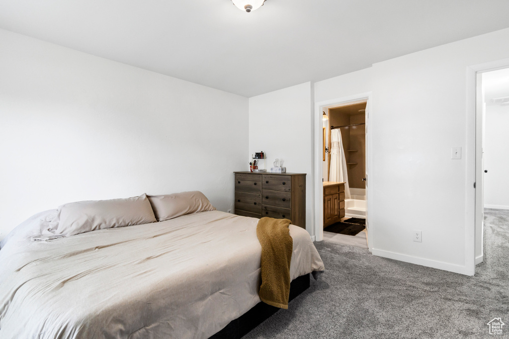 Bedroom with carpet floors and baseboards
