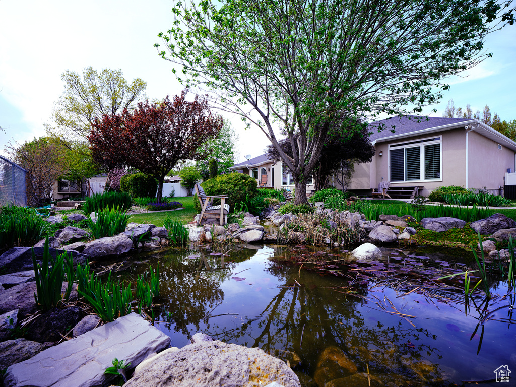 View of yard featuring a garden pond