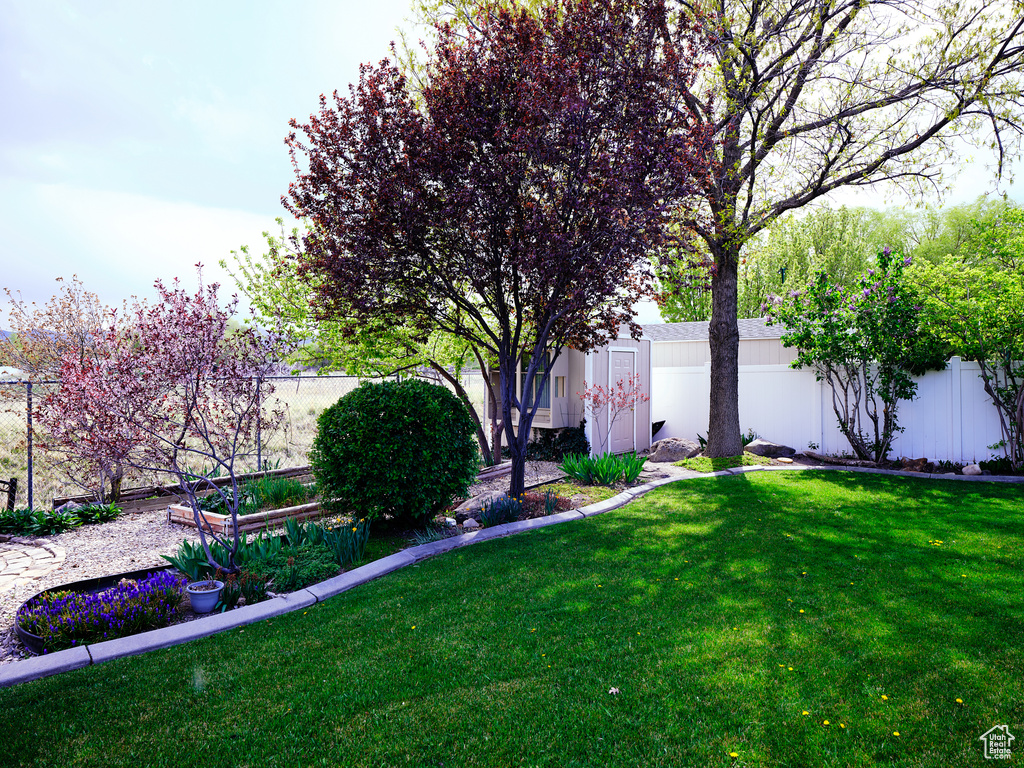 View of yard with a fenced backyard