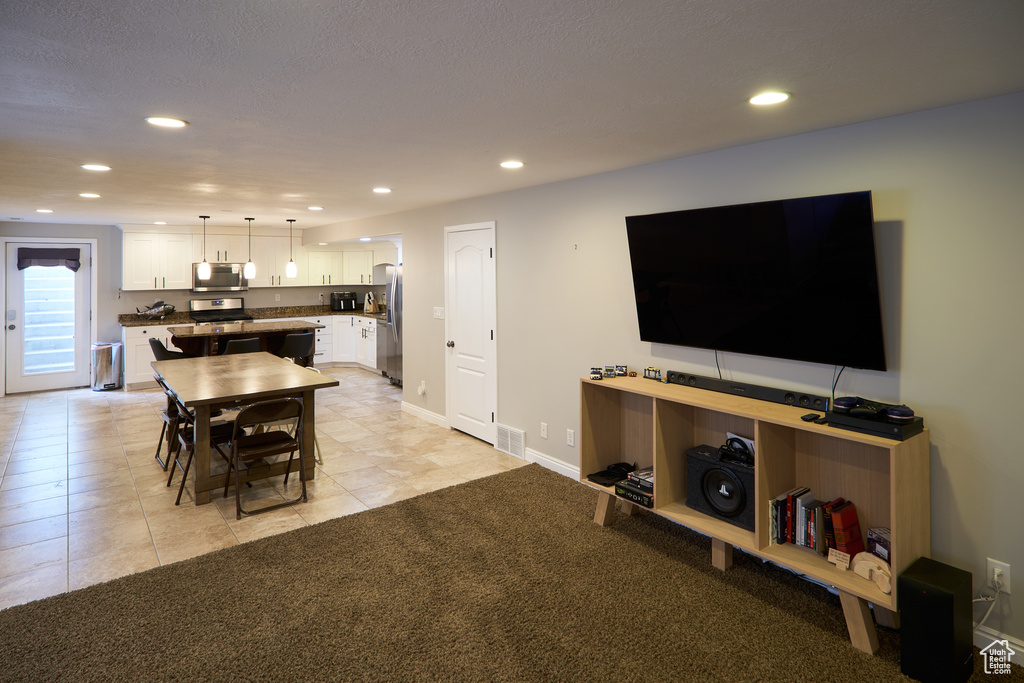 Interior space featuring visible vents, recessed lighting, baseboards, and light tile patterned floors