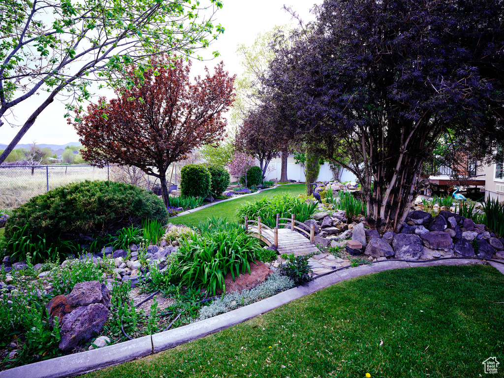 Surrounding community with a lawn and fence