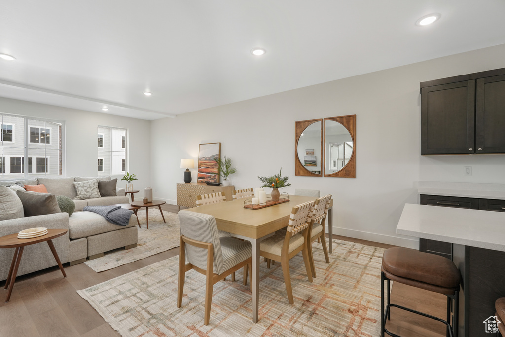 Dining area featuring recessed lighting, baseboards, and light wood-type flooring