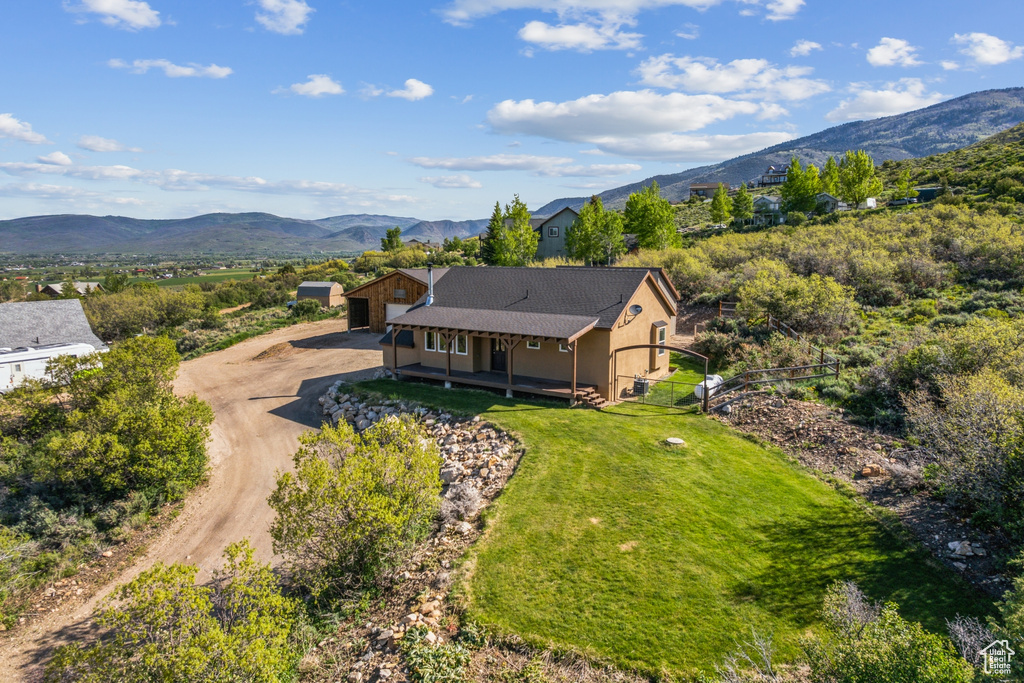 View from above of property with a mountainous background