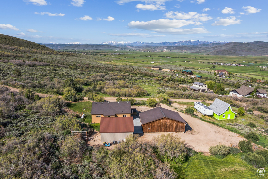 View of subject property with a mountain backdrop