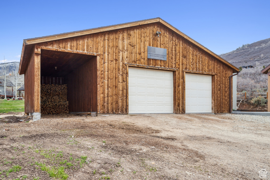 Detached garage featuring a mountain view