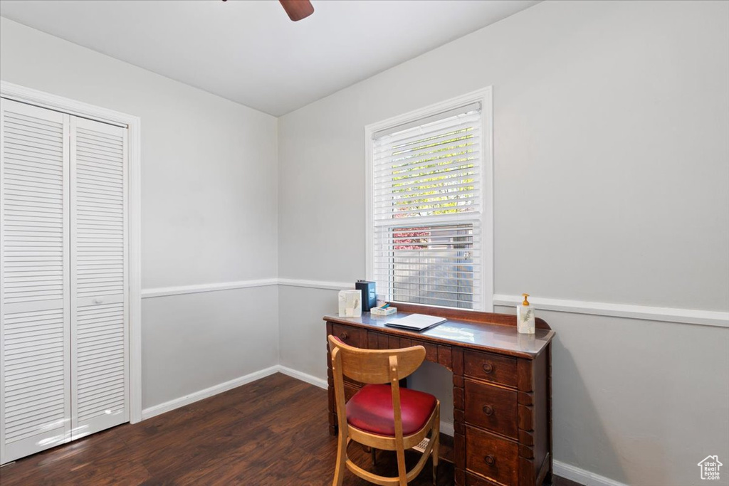 Home office with lofted ceiling, wood finished floors, a ceiling fan, and baseboards