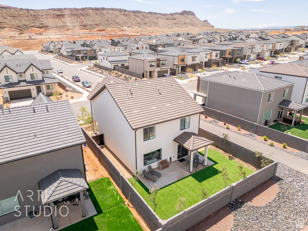 Drone / aerial view featuring a mountain view and a residential view
