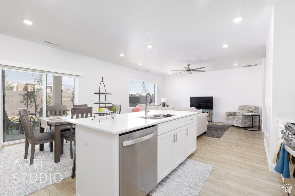 Kitchen with appliances with stainless steel finishes, a healthy amount of sunlight, recessed lighting, and a sink