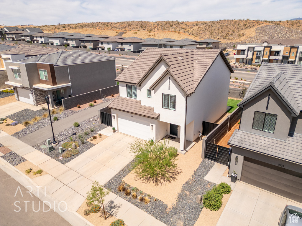 Drone / aerial view with a residential view and a mountain view