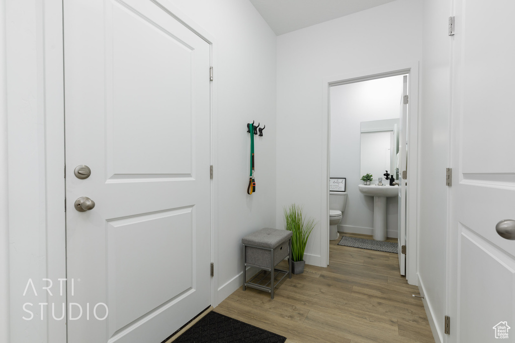 Interior space featuring baseboards and light wood-style floors
