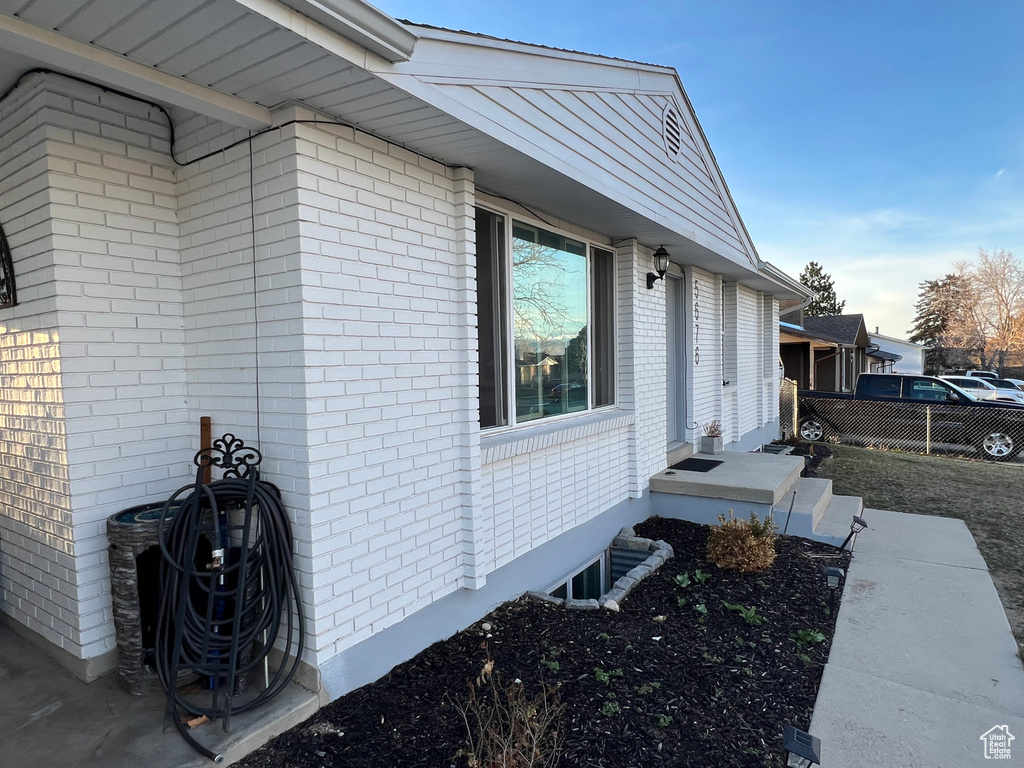 View of side of home with brick siding