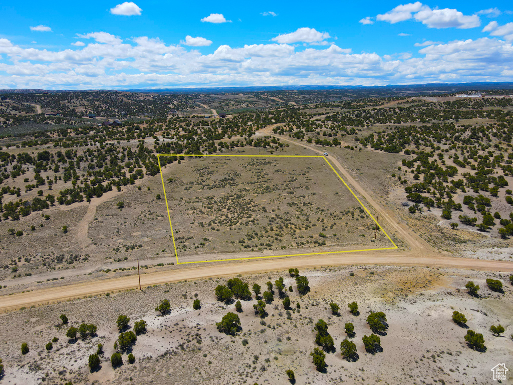 Aerial view of sparsely populated area featuring a desert landscape and property boundaries highlighted
