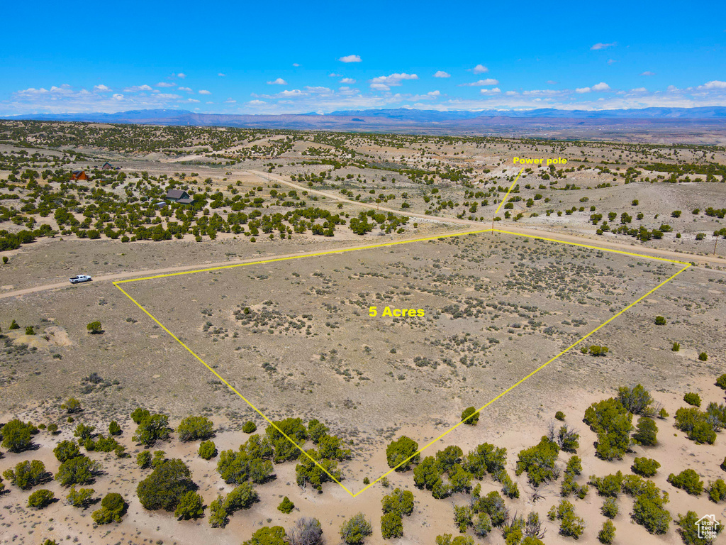 View of rural area with a desert landscape, a mountainous background, and property boundaries highlighted