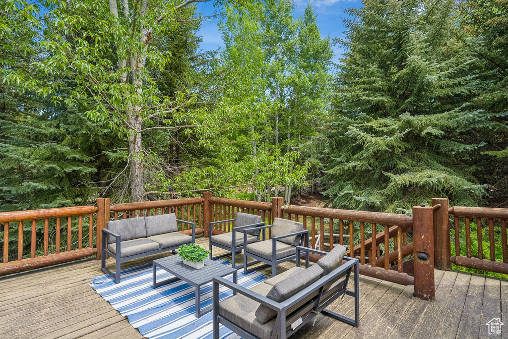Wooden terrace with an outdoor living space