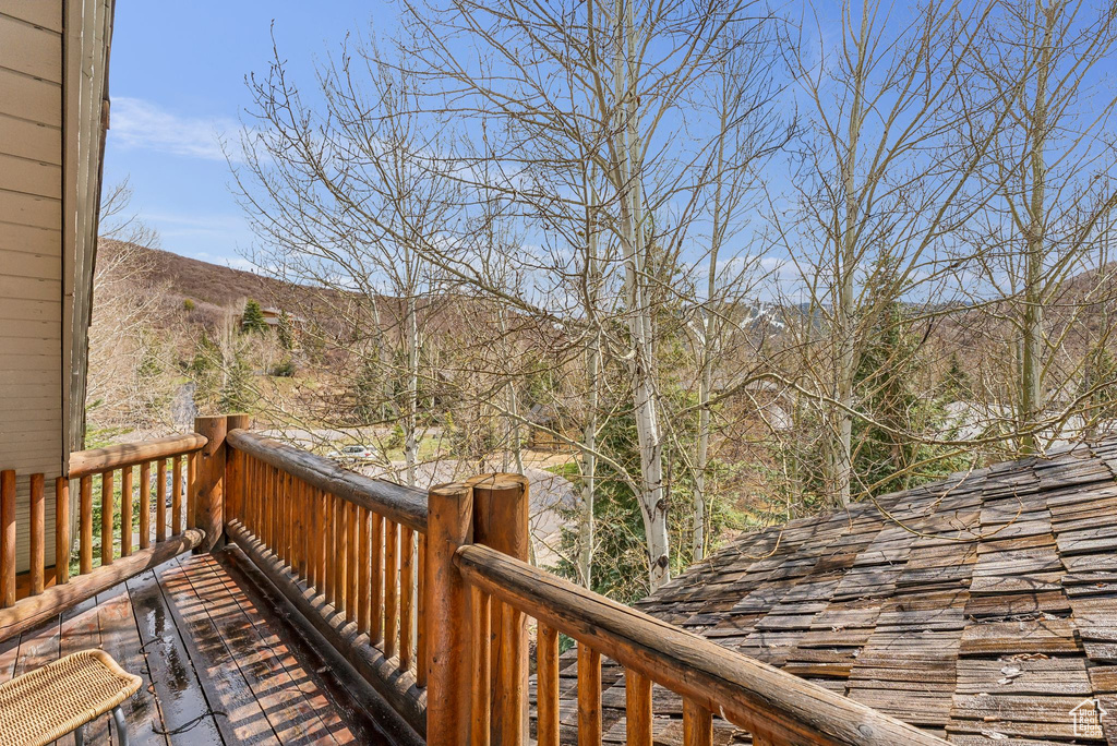 Wooden deck featuring a mountain view