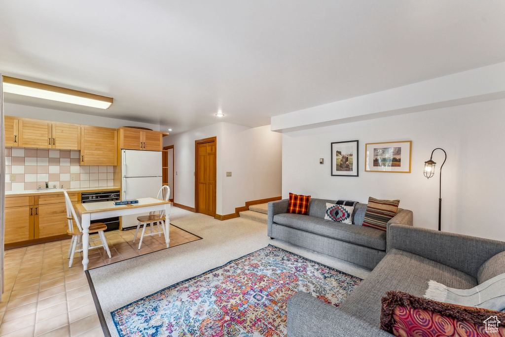 Living area featuring baseboards and recessed lighting