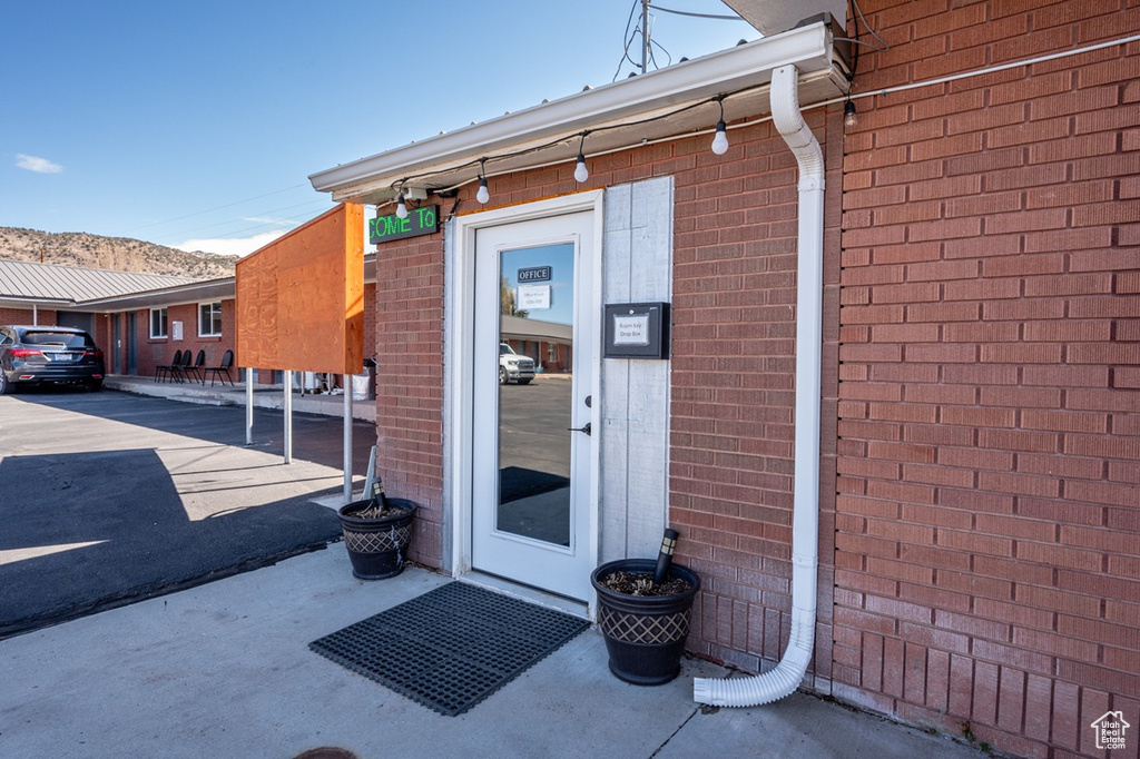 Property entrance with brick siding