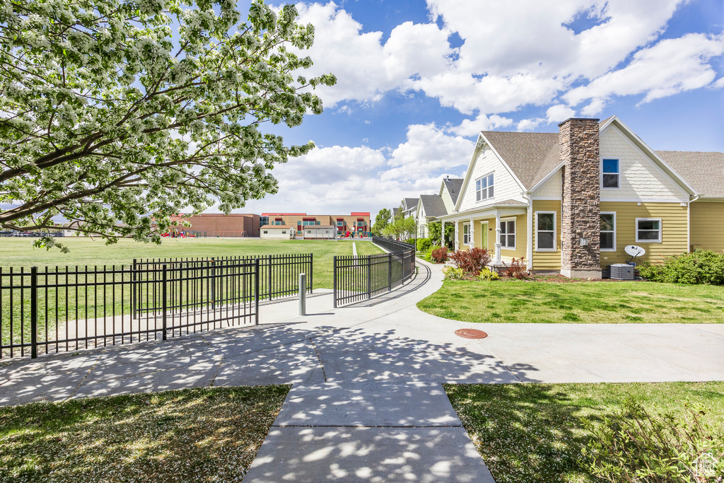 Exterior space with fence and a yard
